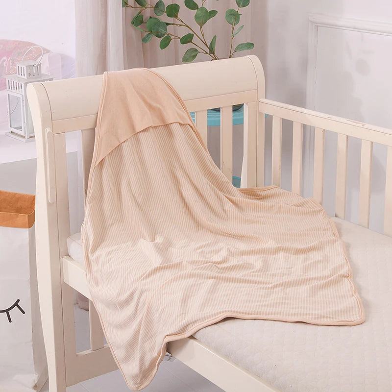 Baby EMF Protection Blanket – Silver Thread Shielding on a crib, providing comfort and safety for infants.